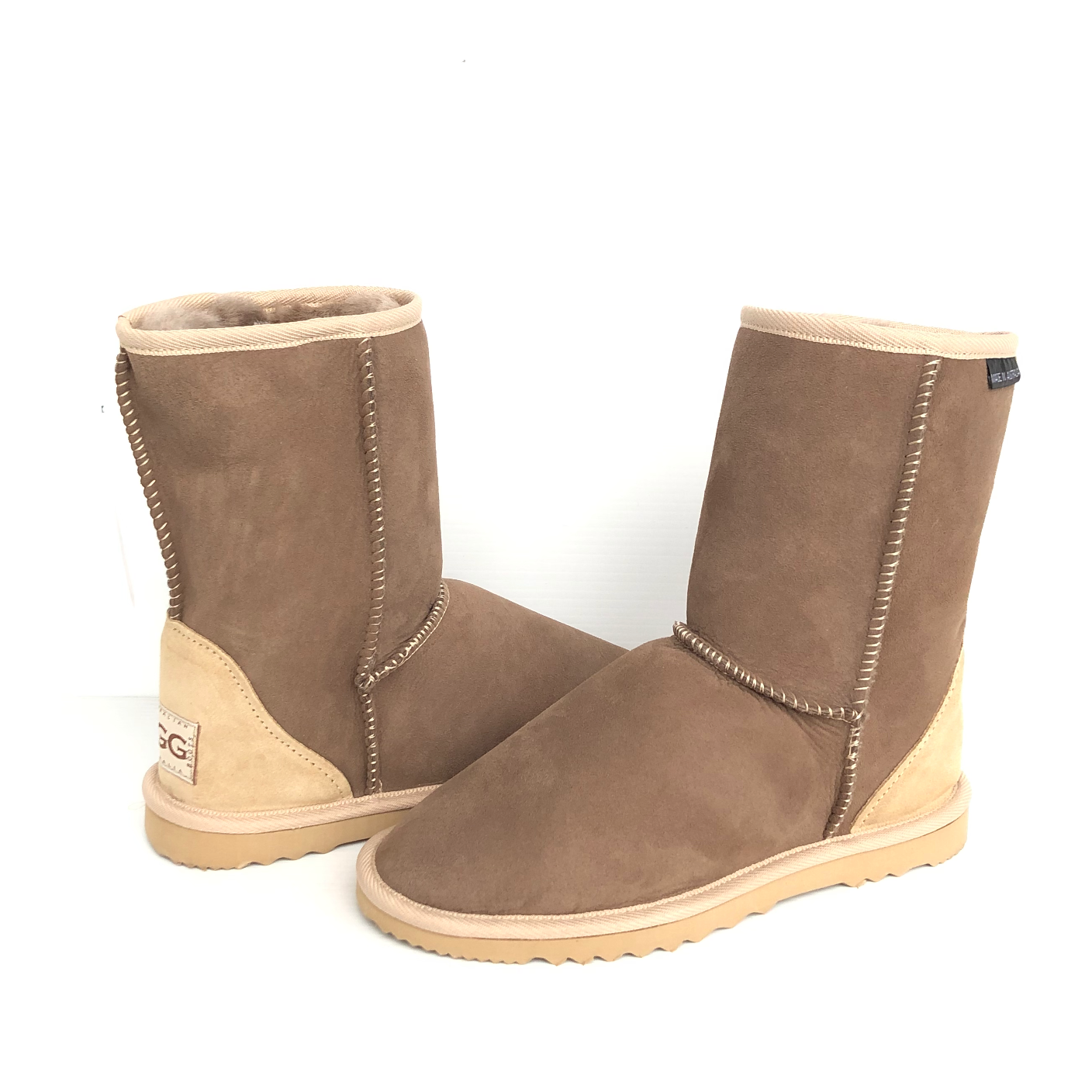 Pair of short ugg boots, chestnut brown colour with lighter brown - sand colour trims