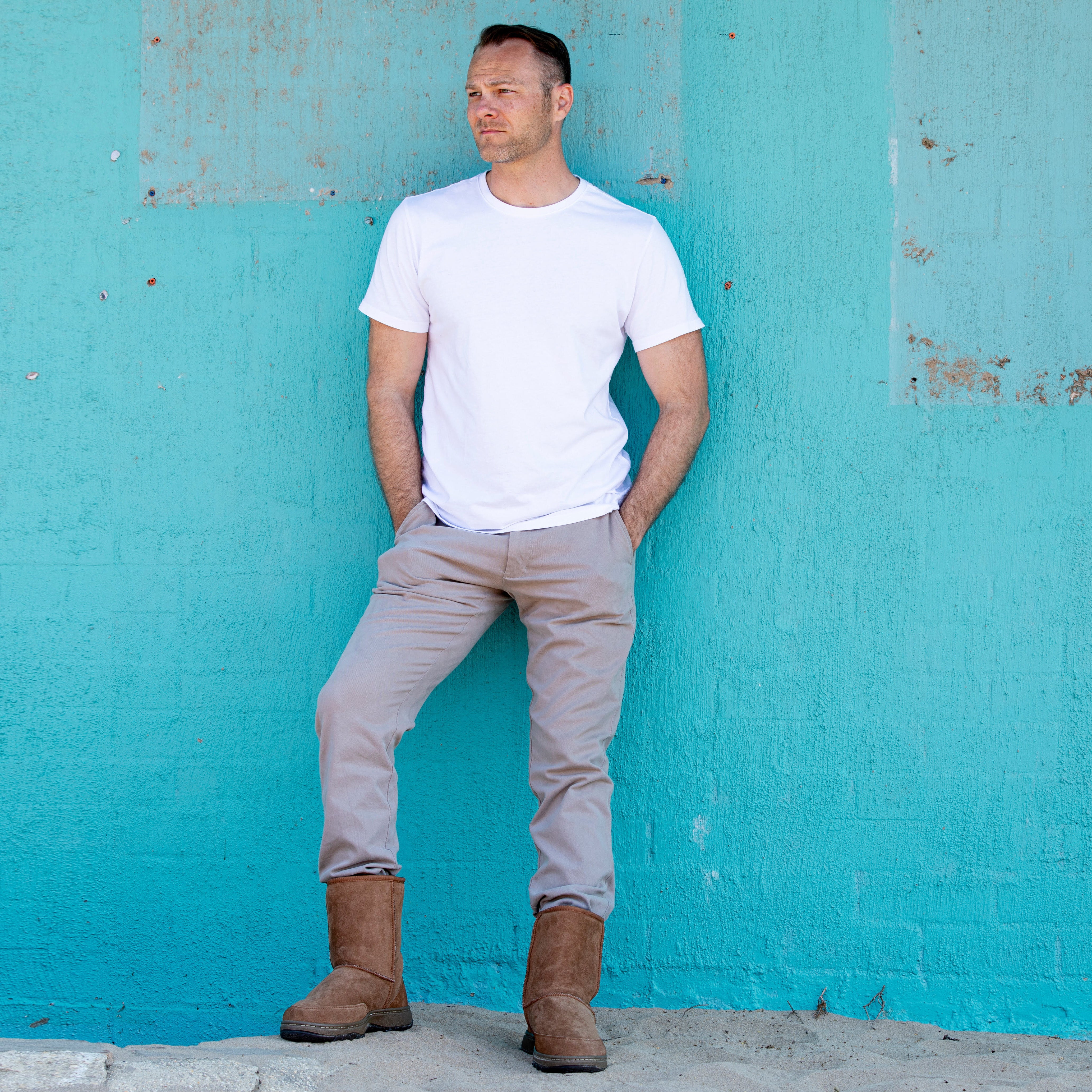 Man standing near wall wearing Australian Made Men's Outdoor Ugg Boots