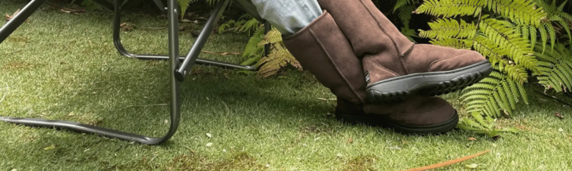 Woman sitting on camping chair wearing chocolate brown, Australian Made Outdoor Ugg Boots