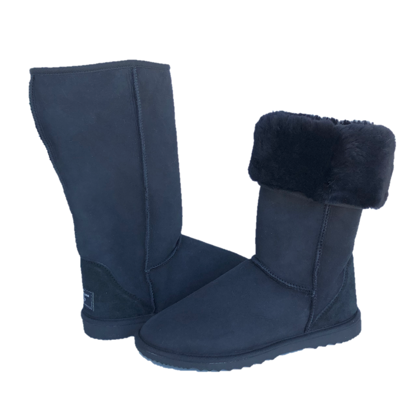 Black tall ugg boots, one boot with sheepskin folded down
