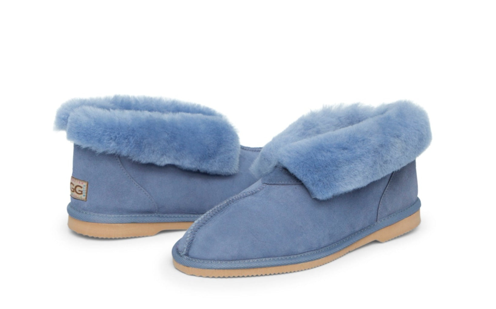 Kid's Ugg Slippers, with sheepskin rolled out at the top in denim blue